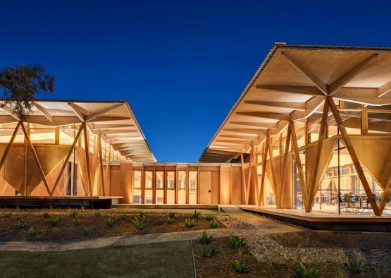 a building with a roof and a garden