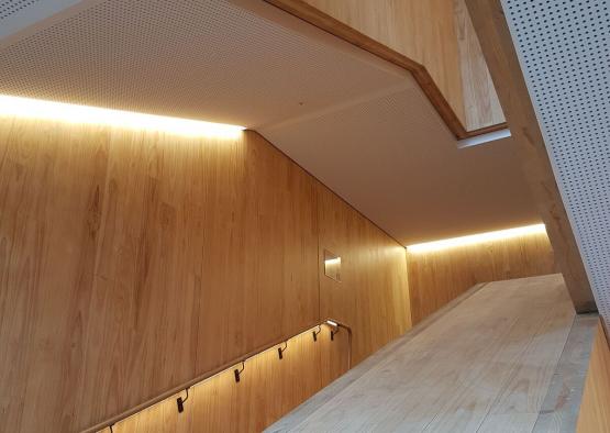 a wooden staircase with lights