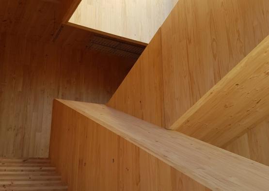 a wooden staircase with a blue sky