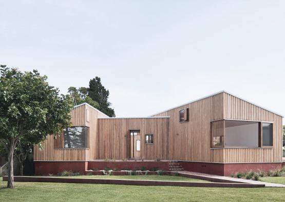 a house with a lawn and trees