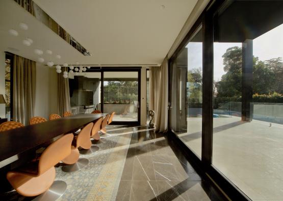 a dining room with a table and chairs