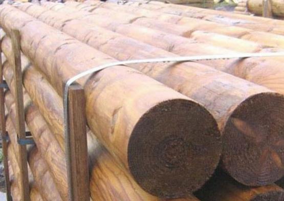 a stack of logs on a rack