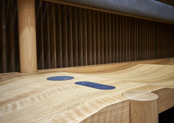 a wooden bench with blue circles on it