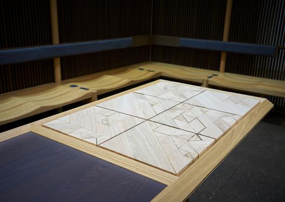 a wooden table with a square pattern on it