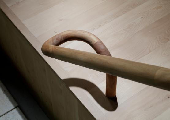 a wooden handle on a wooden surface