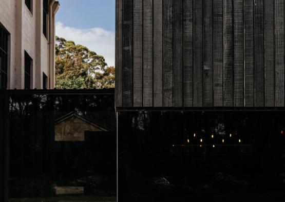 a black building with glass windows