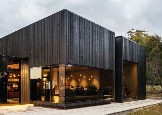 a building with a wooden deck and a wood floor