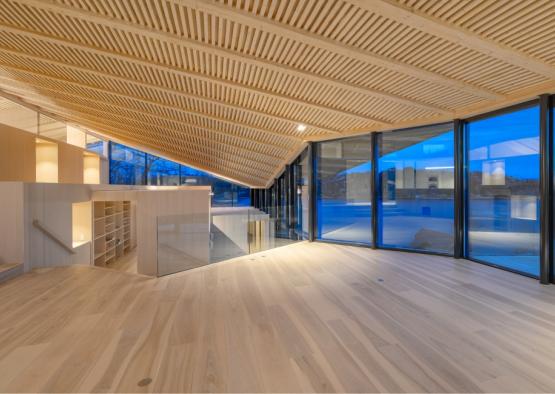 a room with glass walls and a wood floor