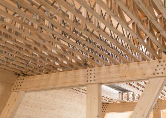 a wooden structure with metal beams