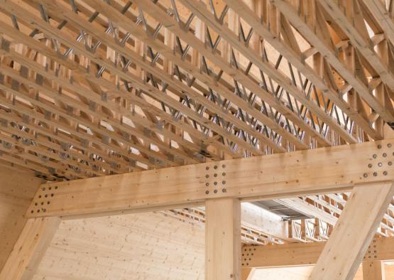 a wooden structure with metal beams