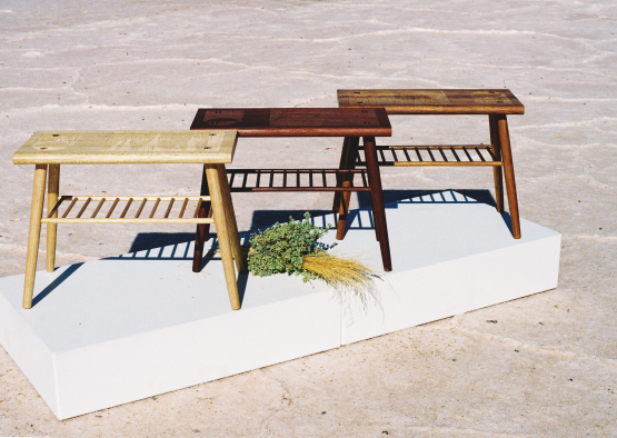a group of wooden tables on a white platform