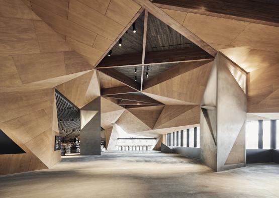 a large room with a triangular ceiling