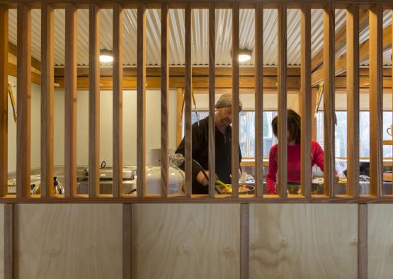 a man and woman cooking in a kitchen