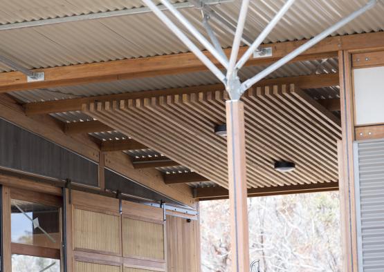 a wooden structure with a metal roof