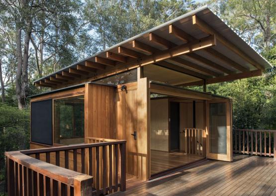 a wooden house with a roof