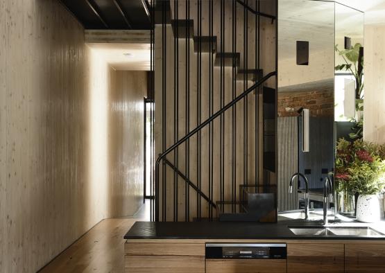 a kitchen with a spiral staircase