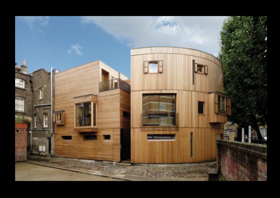 a wooden building with a round roof