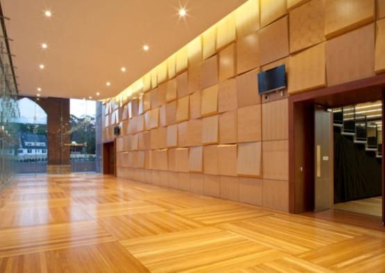 a room with a wooden floor and a large doorway