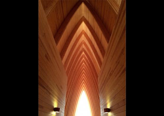 a wooden ceiling with a light coming through