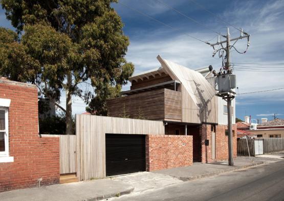 a house with a garage and a tree