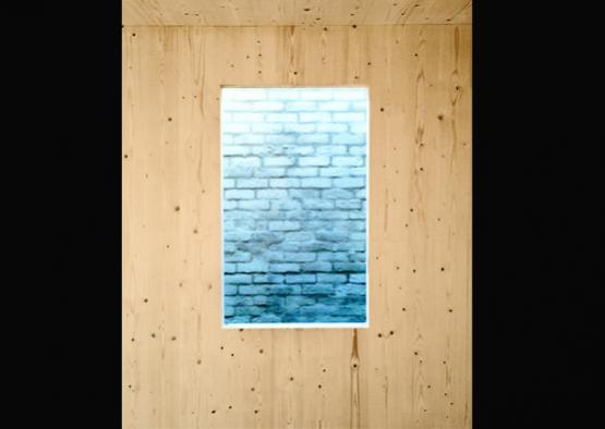 a window in a wood wall
