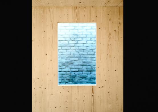 a window in a wood wall