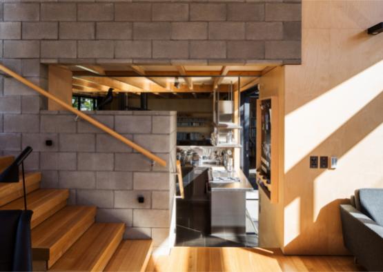 a kitchen and stairs in a house