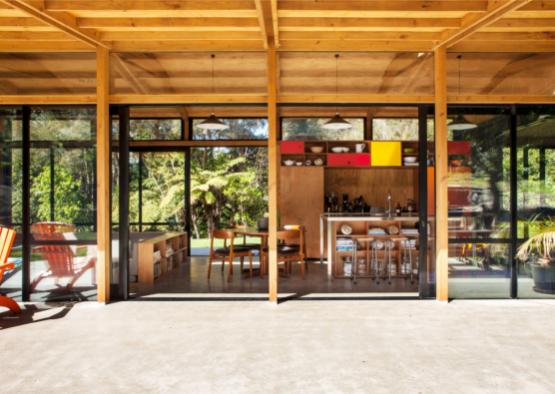 a room with a dining table and chairs