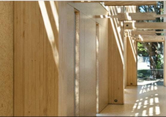 a wooden structure with a shadow on the ceiling