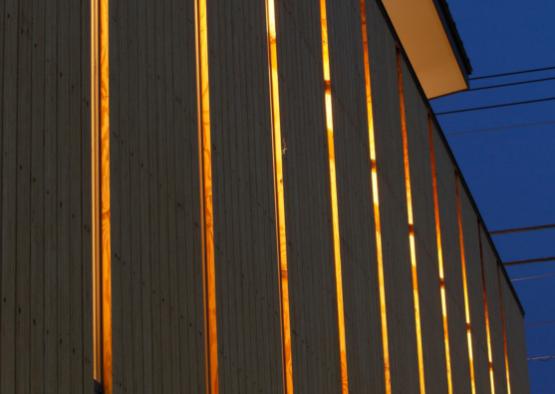a building with a light shining through the windows