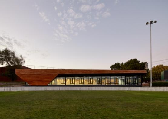 a building with a green lawn