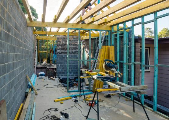 a construction site with a wood frame and tools
