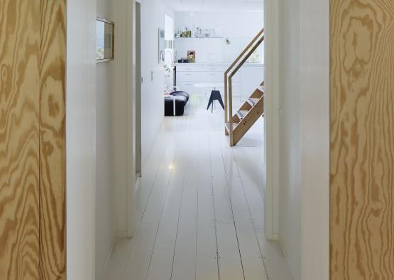 a hallway with a wood floor