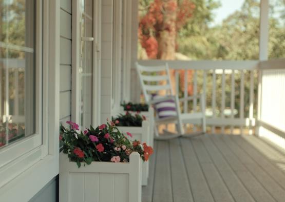 a white planters on a porch