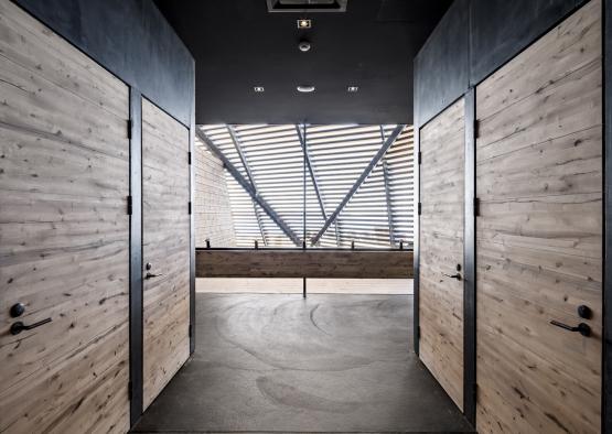 a hallway with wooden doors