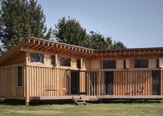 a building with a deck and a porch