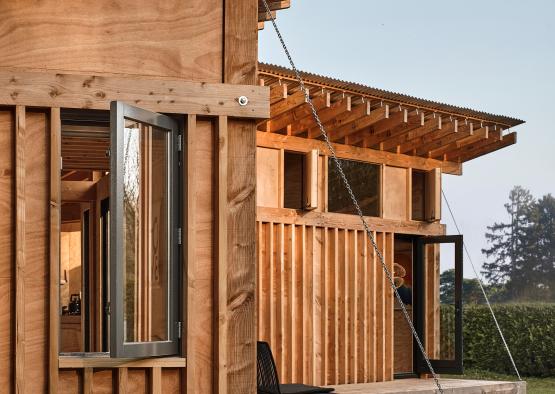 a wooden house with a swing