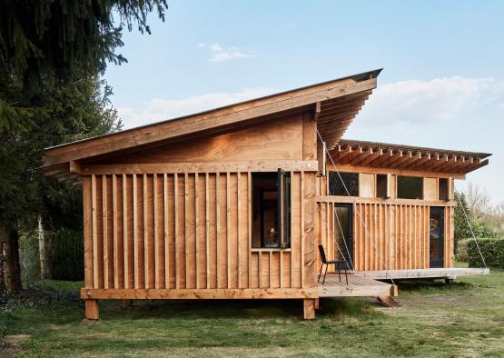 a wooden house with a porch and a porch