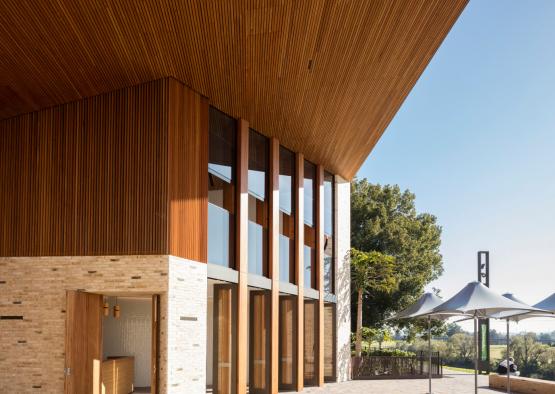 a building with a wood paneled roof