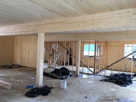 a room with wood beams and a wooden ceiling