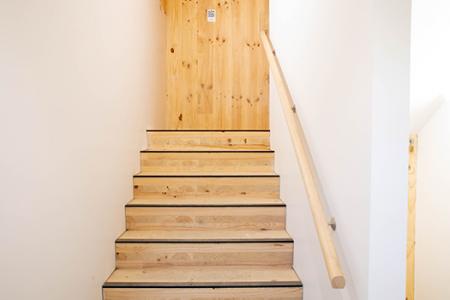 a wooden stairs with a door