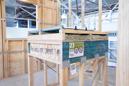 a wooden box with a metal roof