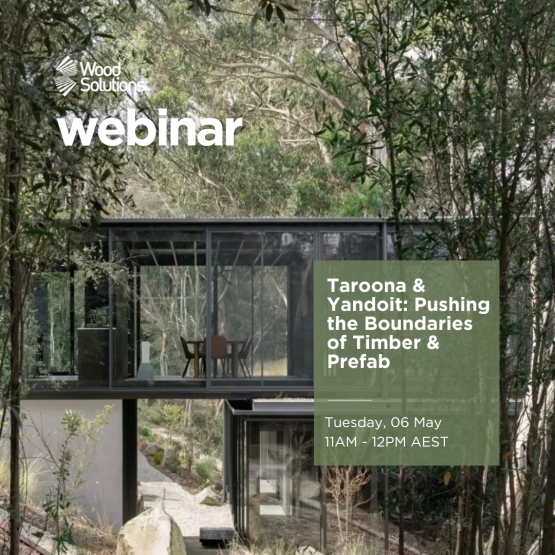 Image of multi-level house with large glass windows sitting amongst gum trees