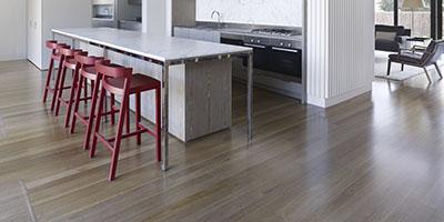 a kitchen with a table and chairs