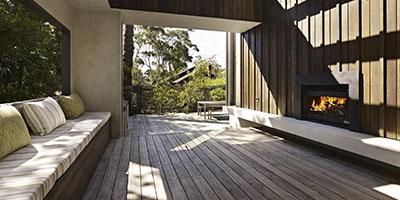 a wooden deck with a bench and a bench