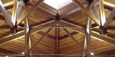 a wooden roof with a light in the ceiling