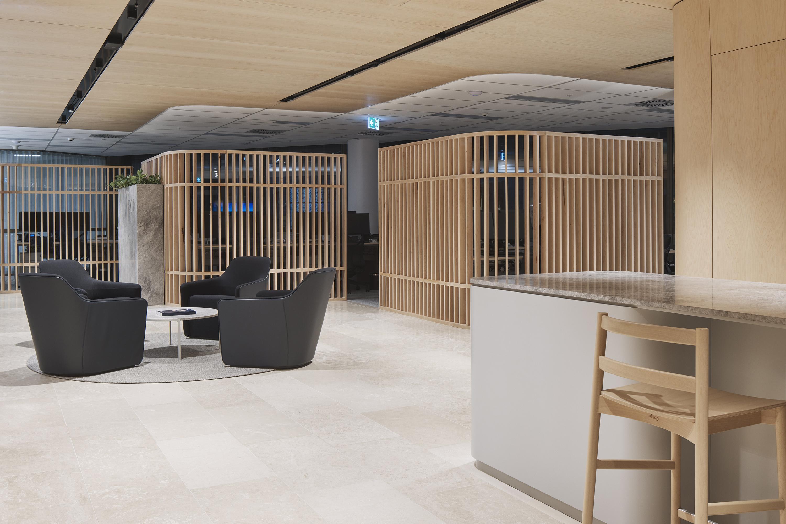 a room with a bar and chairs