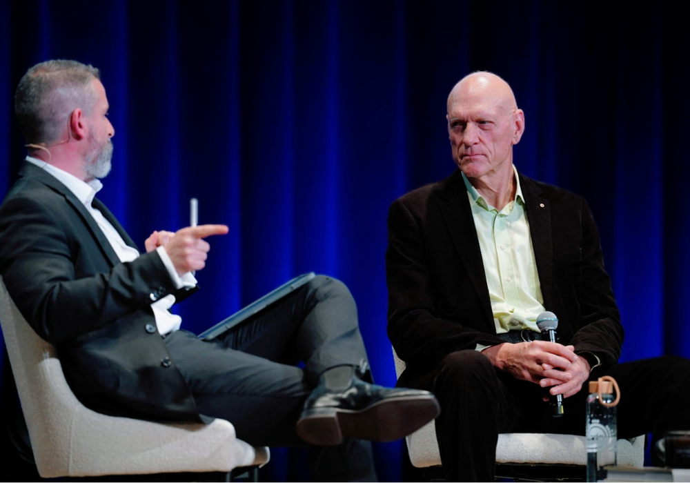Two men having a discussion while seated