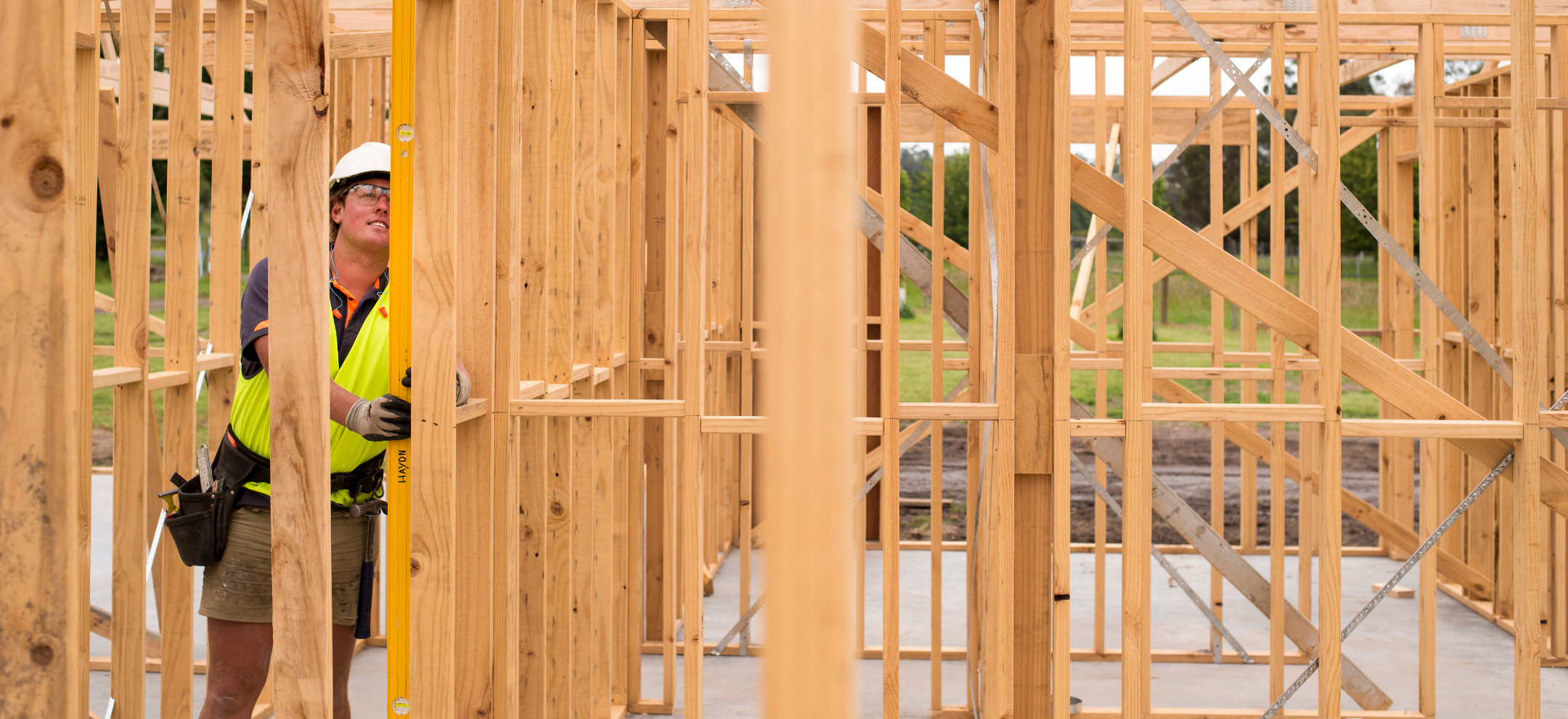 Builder checking in on timber frame house build