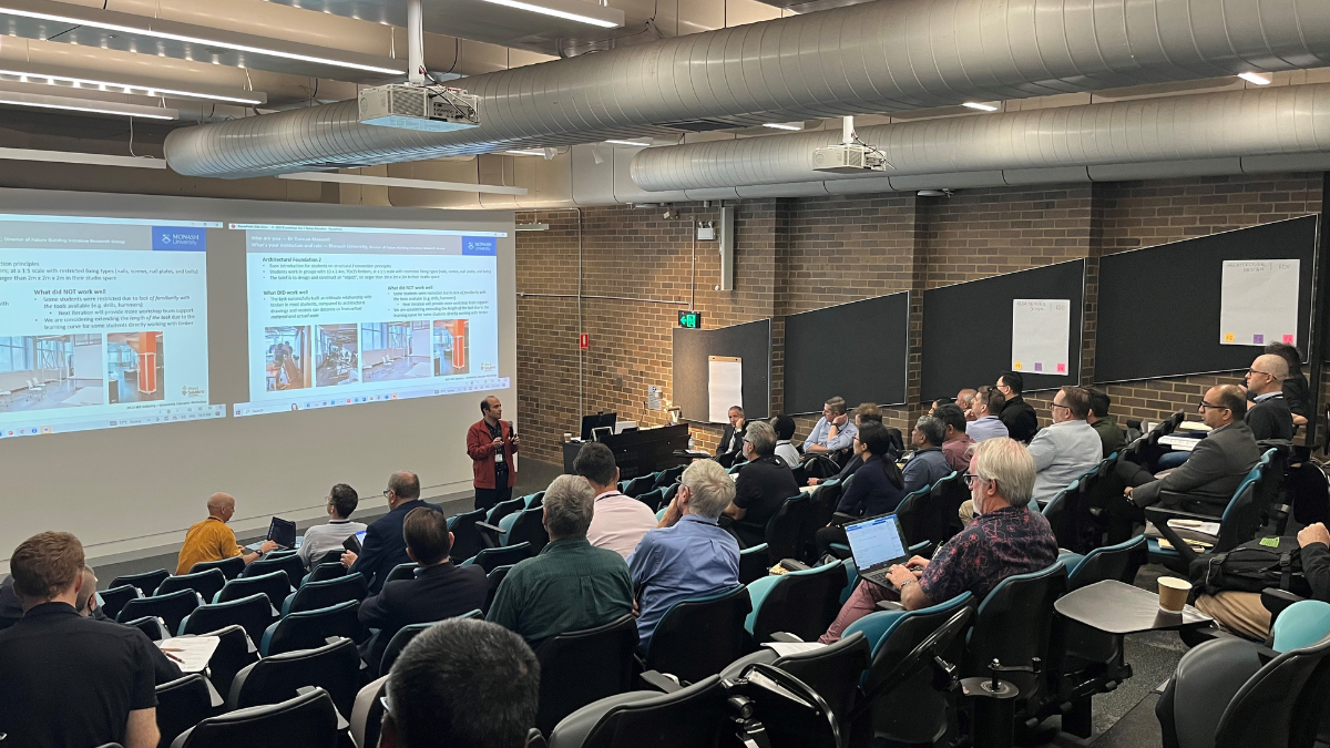 Group of people watching presentation in an auditorium
